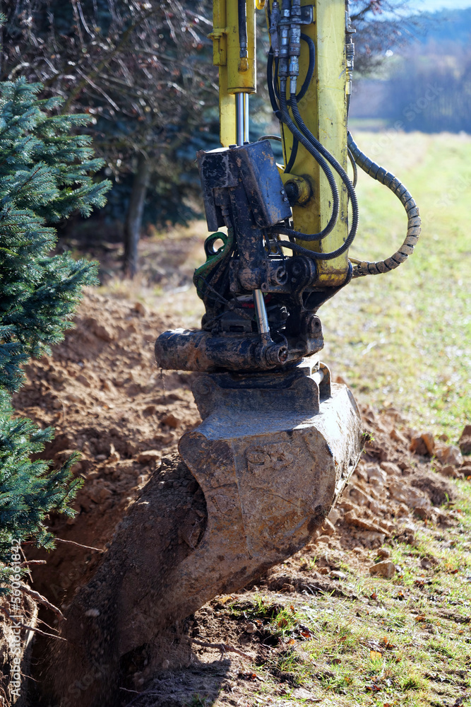A small excavator at work on a construction site