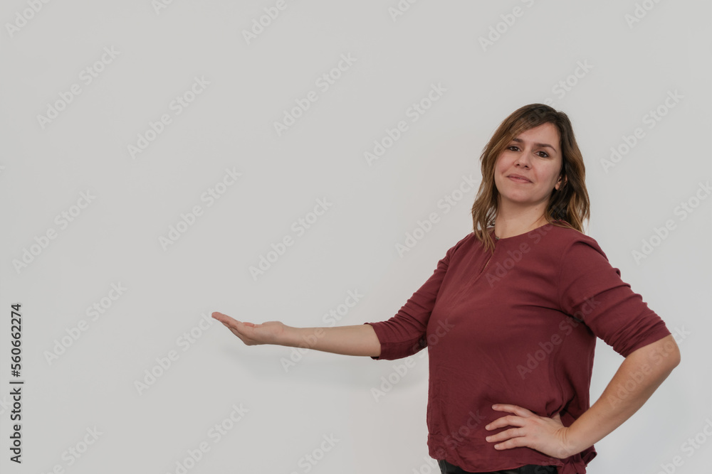woman with her hand outstretched to the copy space woman with her hand outstretched to the copy space