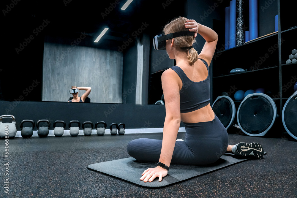 Sports fit Young athletic woman in virtual reality fitness,pilates,relaxation,mental health.Active lifestyle,personal care,health.Wellness,workout,physical health.Smart fit,healthy lifestyle,vr - obrazy, fototapety, plakaty 