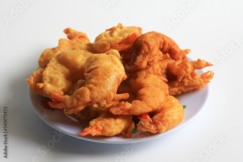 Udang Goreng Tepung or Tempura. Floured fried shrimp, simple traditional Indonesian food and often made at home, isolated on white background.