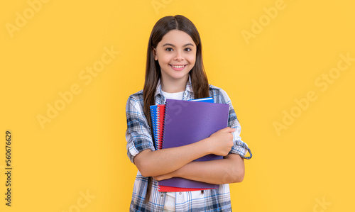 cheerful teen school girl isolated on yellow. teen school girl in studio. teen school girl