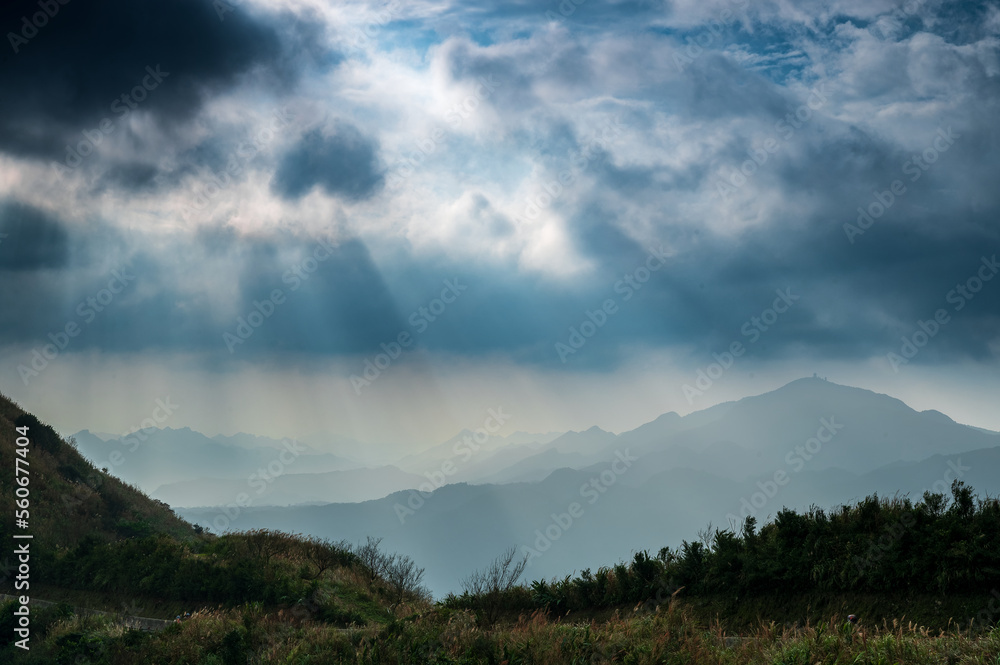 Watch the romantic Crepuscular Ray (cloud gap light) on the mountain. Buyan Pavilion, Shuangxi District, New Taipei City. Taiwan