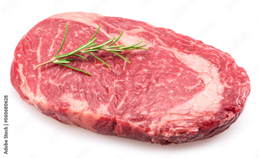 Raw ribeye steak with rosemary twig on it on white background. Top view. Raw ribeye steak with rosemary twig on it on white background. Top view.