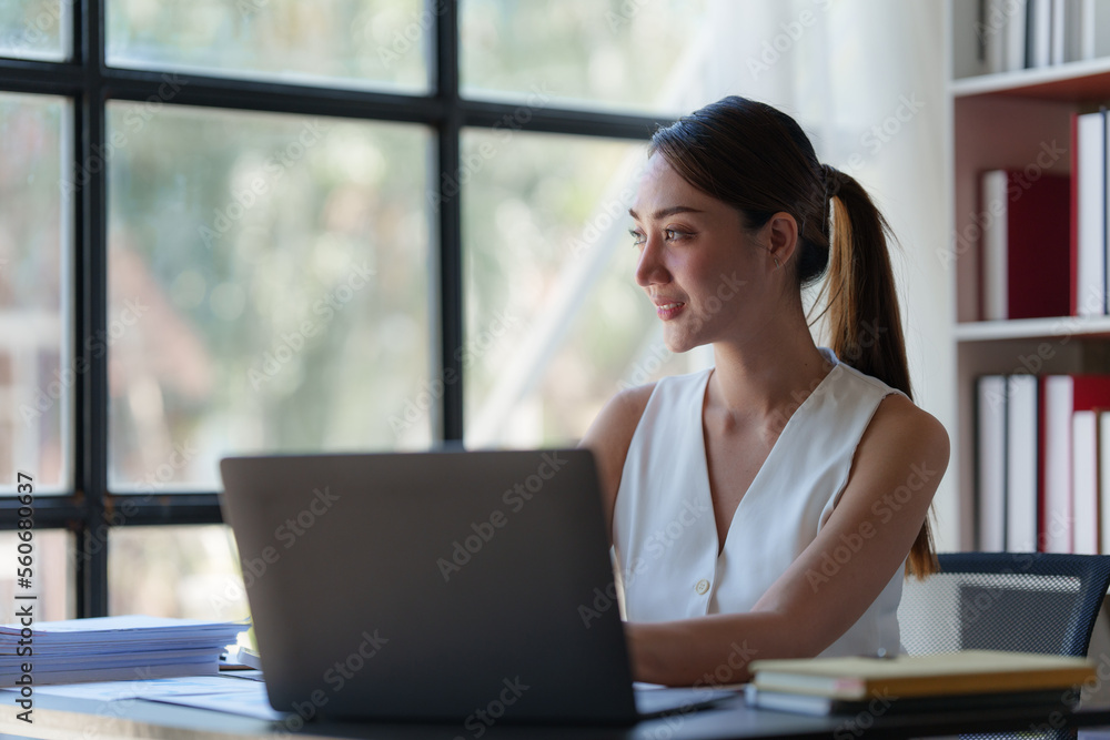 Asian Business woman working at home office and analyze financial report document. Accounting and Finance concept Asian Business woman working at home office and analyze financial report document. Accounting and Finance concept