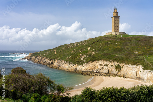 Hercules tower roman lighthouse since Lapas beach in the city of A Coruña in a sunny day, Galicia, Spain.