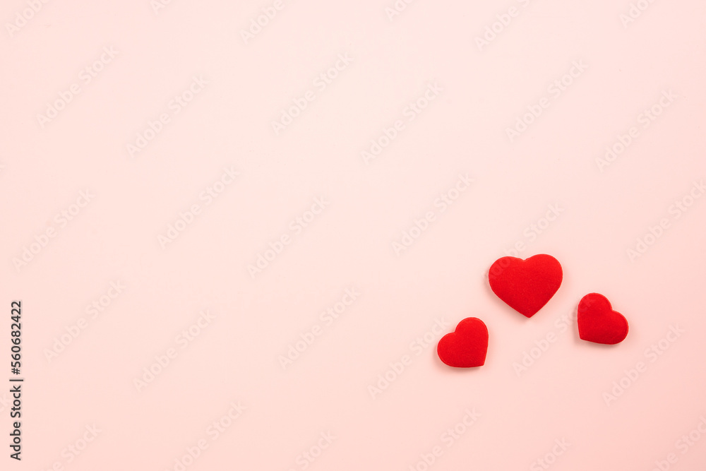 Valentine's Day design concept of red heart on pink background.