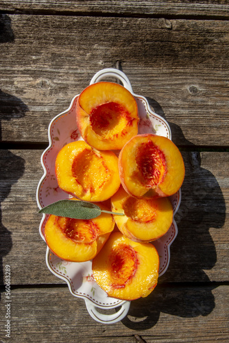 fresh ripe peaches on a porcelain plate