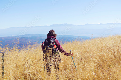 Woman Hiking in the autumn mountain . Vitosha mountain ,Bulgaria