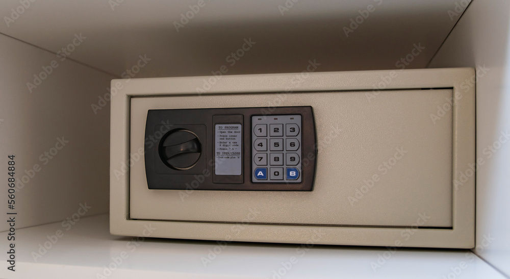 Private safe with electronic lock stands in the closet Private safe with electronic lock stands in the closet