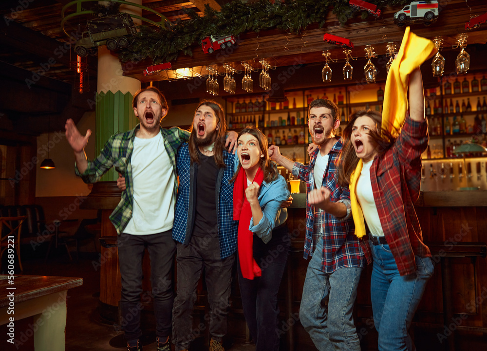custom made wallpaper toronto digitalExcited, happy men and women, friends watching match, championship in pub Fans emotional cheering up favourite team.