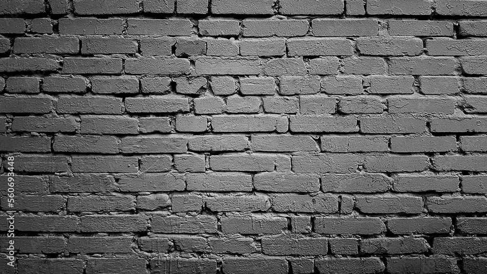 Black brick wall background texture with vignette.