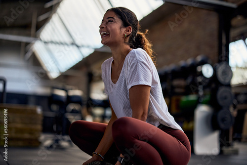 Woman laughing after a gym workout photo