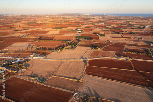 Drone view of fields with red soil around Avgorou village in Famagusta District in Cyprus island country photo