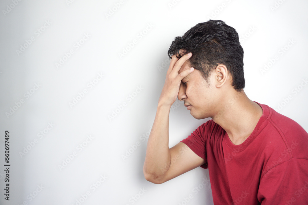 Sad man holding his forehead. Stress, sadness, worry Sad man holding his forehead. Stress, sadness, worry