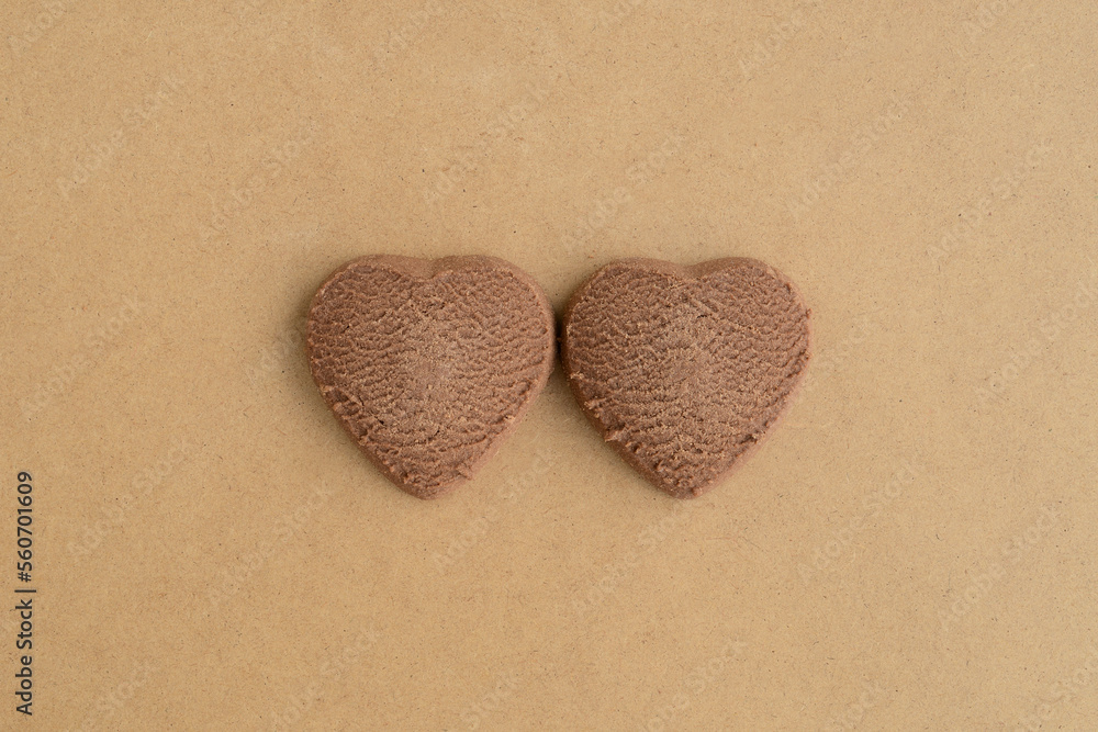 Two heart shaped cookies. Chocolate cookies in shape of hearts, close-up. Creative Love banner concept, Hearts Valentine's Day Greeting Card Background	