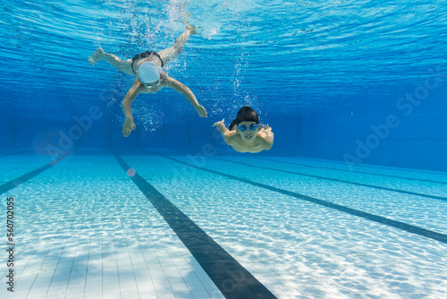 two kids swimming in the water