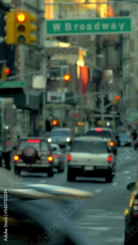 Busy street in New York City, vehicles and pedestrians, vertical short video photo