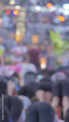 Wallpaper Mural Unrecognisable crowd, people practicing yoga exercises, Times Square, NYC, vertical short video Torontodigital.ca