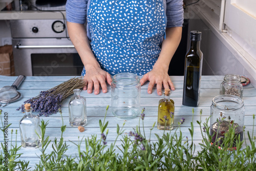 Young woman making homemade lavender essential oil © Cavan