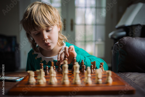 Boy's playing chess in Christmas pajamas photo