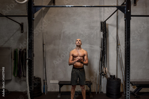 Sportsman preparing to do pull ups photo