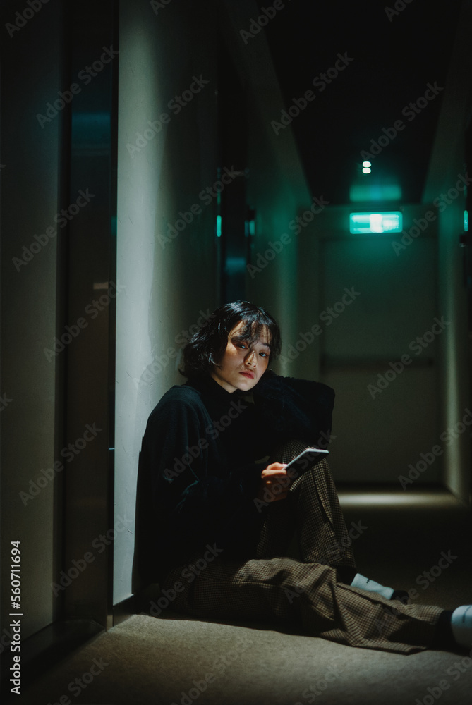 Girl Sitting On The Floor Using Cell Phone Girl Sitting On The Floor Using Cell Phone
