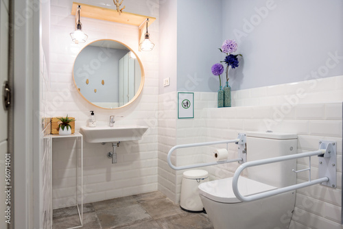 Accessible toilet in modern restroom