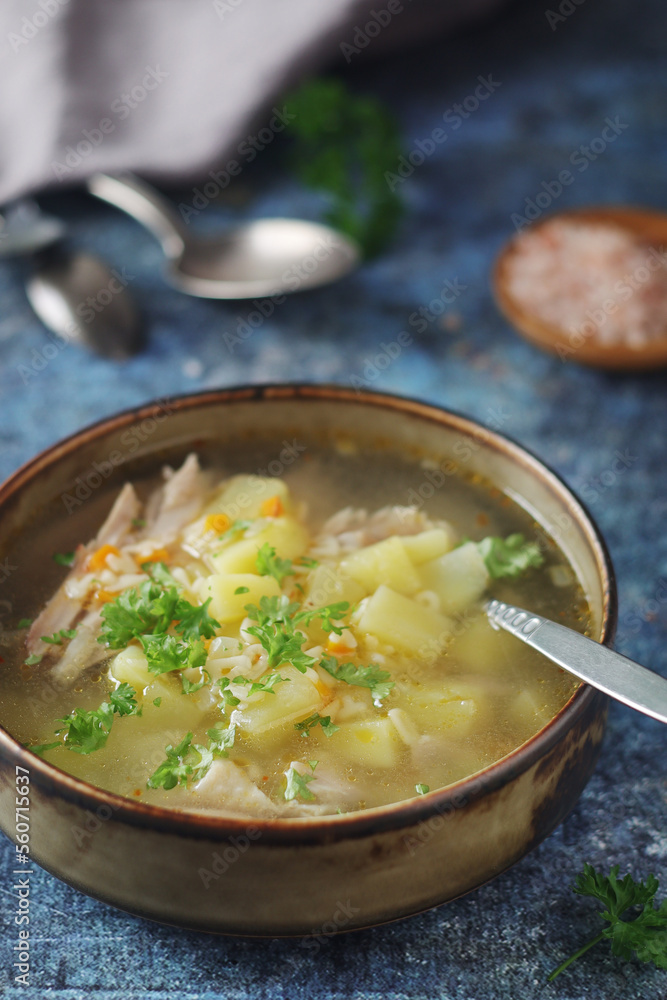 A bowl with chicken soup with pasta