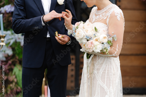 Anonymous newlyweds ceremony ring photo