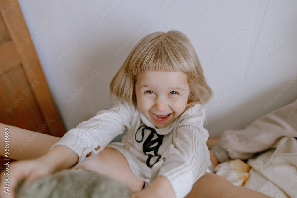 portrait of a blonde girl with a bear in her hands
portrait of a blonde girl with a bear in her hands