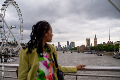 London tourist candid portrait with London Eye and Big Ben