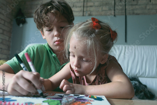 Siblings paint together