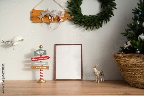 Mockup of a wooden frame in the interior of a room decorated for Christmas