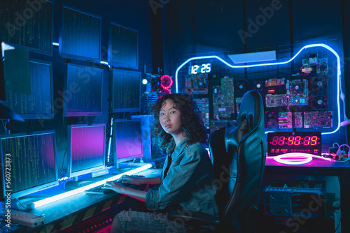 Portrait of Asian Women programmer, staring confidently into camera