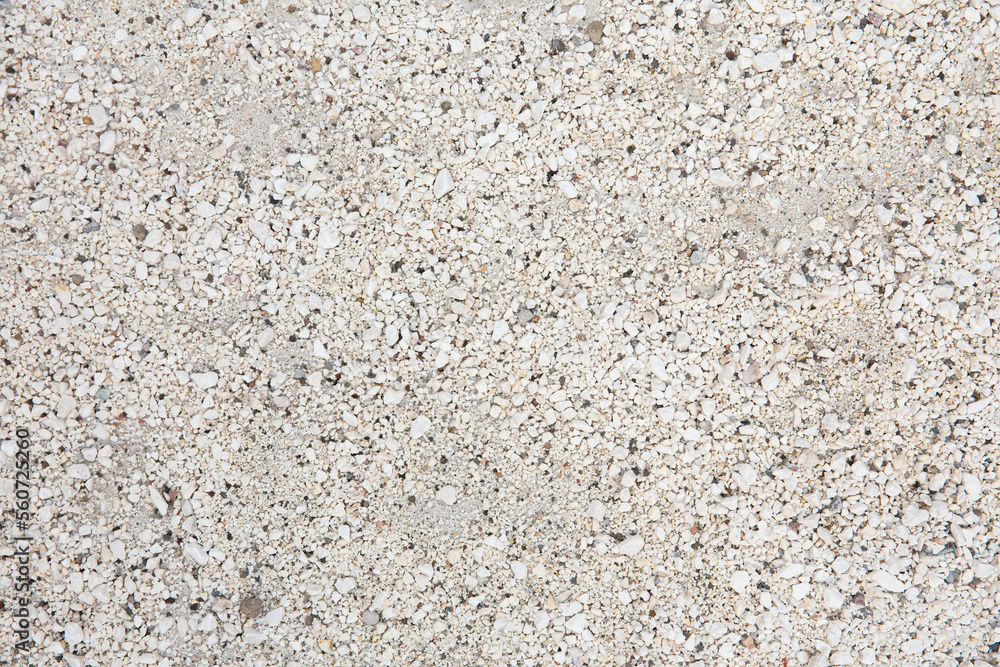 Granite chips, white stone texture. Lots of small white stones. Granite chips, white stone texture. Lots of small white stones.