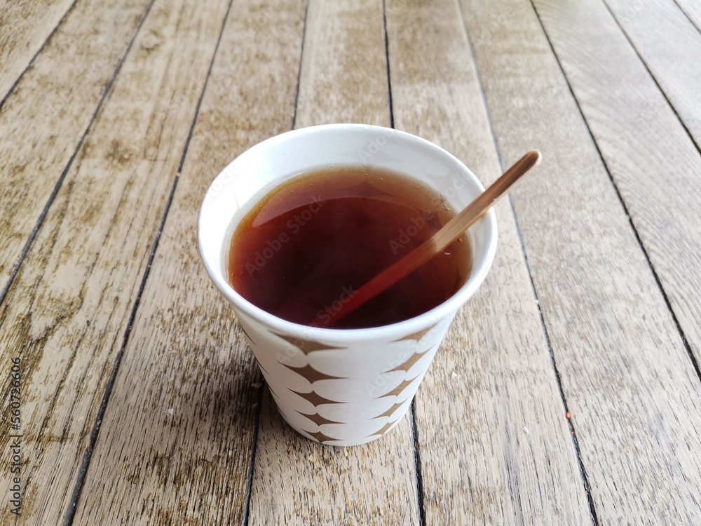 Drinking tea in a cardboard cup. Drinking tea in a cardboard cup.