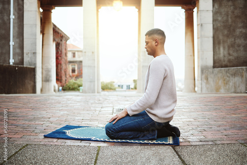 Obraz na plátně Muslim, faith and praying with an islamic man prayer to god on a carpet for eid or ramadan while fasting
