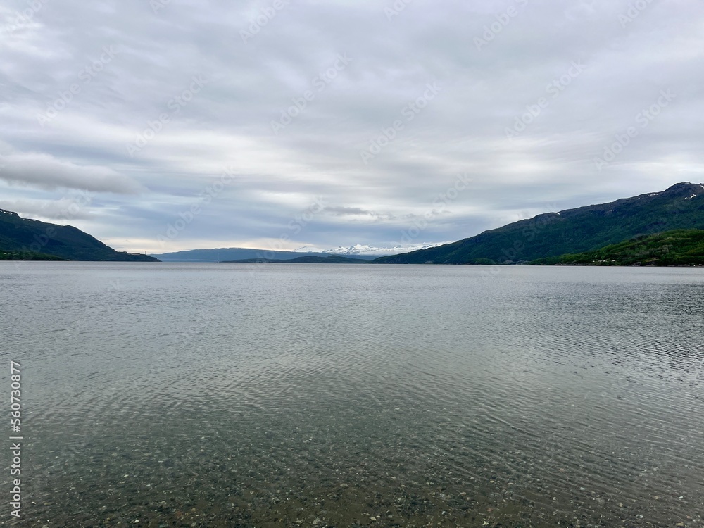 Fjord reflection at the ocean surface, ocean view, mountains Fjord reflection at the ocean surface, ocean view, mountains