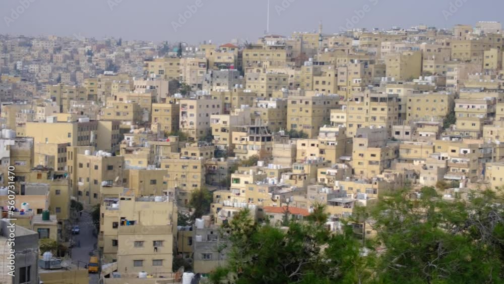 Panoramic landscape view of capital city Amman in Jordan with densely packed houses and buildings Panoramic landscape view of capital city Amman in Jordan with densely packed houses and buildings