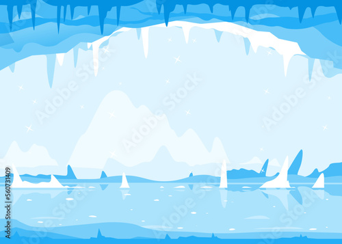 Ice cave with many icicles on the top and ground, cold winter ice background, mysterious fairy-tale cave of ice