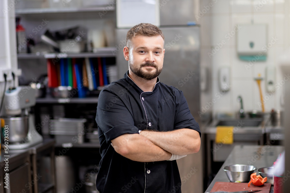 Professional chef in uniform cut fresh vegetables in kitchen. Cook man cooking delicious garnish for clients in restaurant. Culinary concept Professional chef in uniform cut fresh vegetables in kitchen. Cook man cooking delicious garnish for clients in restaurant. Culinary concept