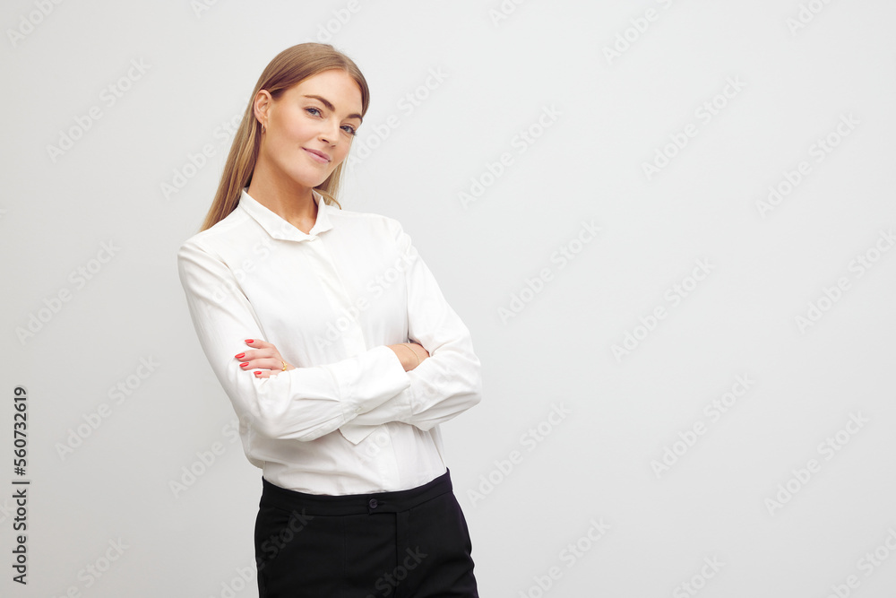 Portrait of beautyful and confident business woman standing with arms crossed looking confident Portrait of beautyful and confident business woman standing with arms crossed looking confident