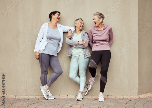 Fotografia Senior women, exercise and funny with retirement, fitness and wellness, vitality and active lifestyle against wall background