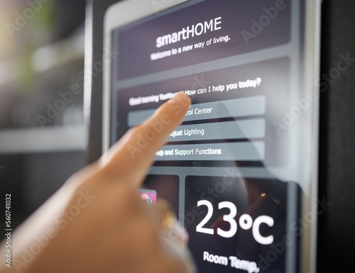 Smart home technology, wall and hands of woman with digital app monitor for thermostat heating, security network or house automation. AI software system, ui control panel or girl with IOT electronics