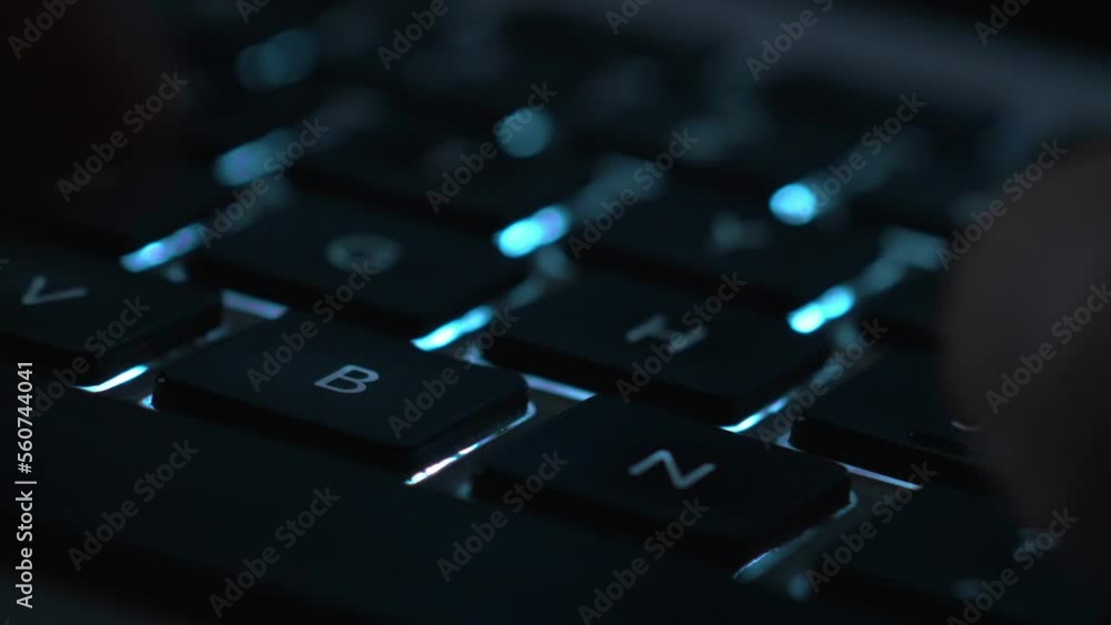 Man typing on keyboard and thinking about what to type next Man typing on keyboard and thinking about what to type next