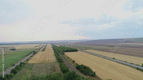 Aerial Shot Of Wide Agriculture Green Lands In Petricani, Romania, Europe photo