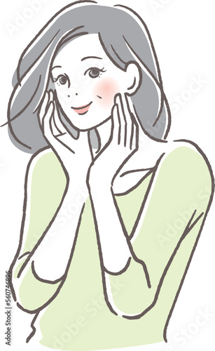 頬に手を当て気持ちよく目を閉じるシニア女性