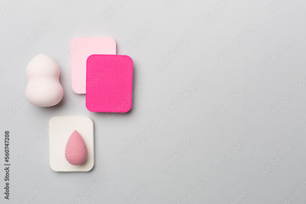 Beauty blenders on color background, top view Beauty blenders on color background, top view
