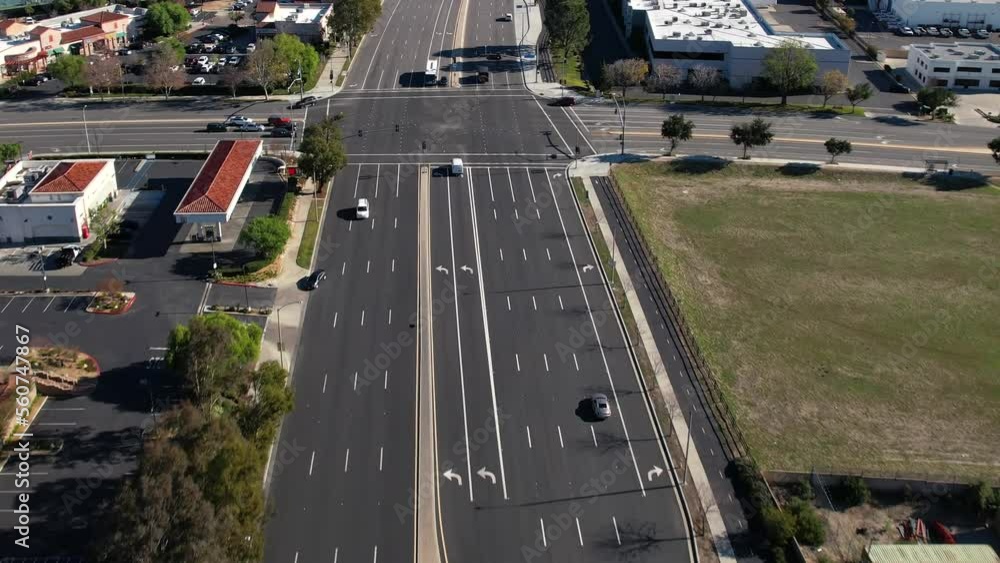 Light traffic on a major roadway - aerial forward follow Light traffic on a major roadway - aerial forward follow