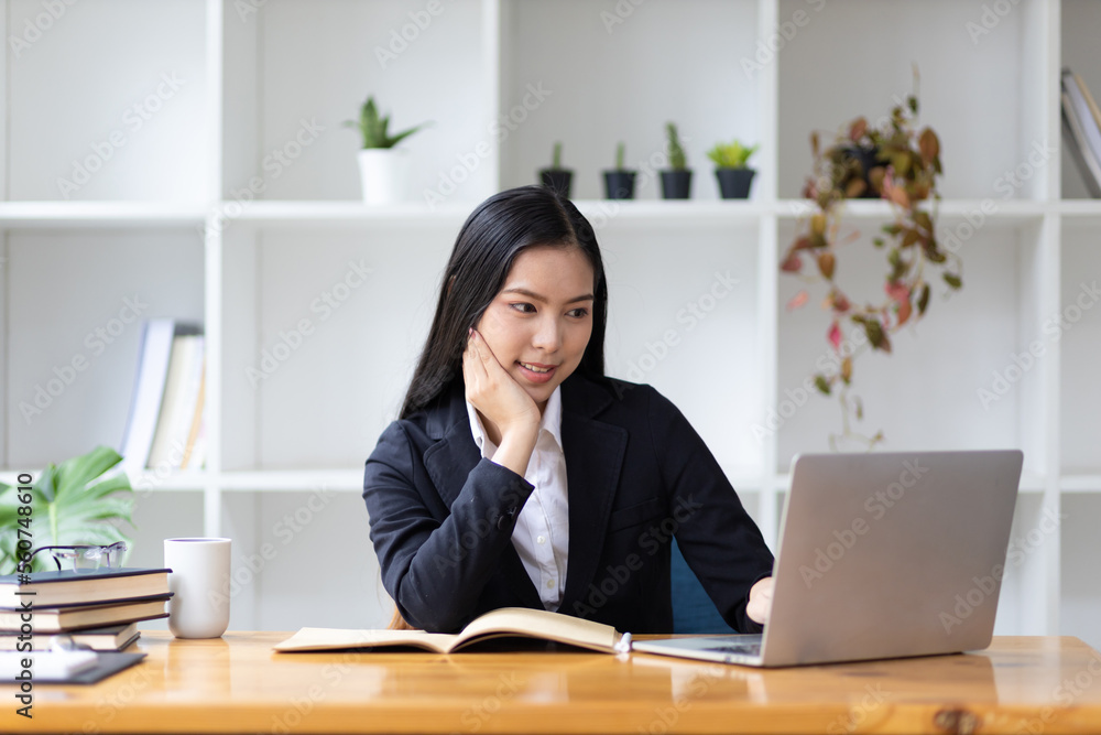 Portrait of beautiful asian businesswoman working with laptop in office. Portrait of beautiful asian businesswoman working with laptop in office.